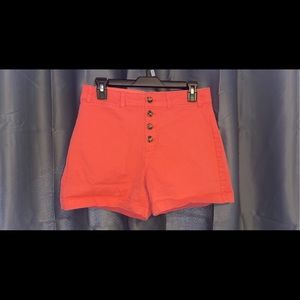 coral-orange high waisted shorts